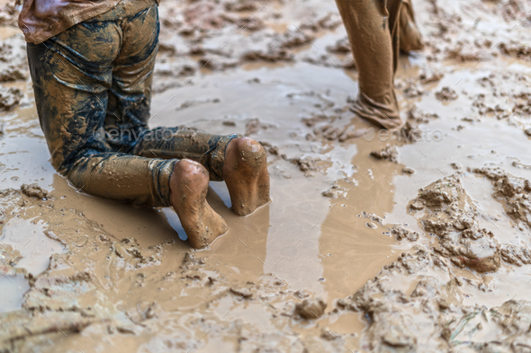 Nimble toddler stamps feet in muddy pudd, Stock Video