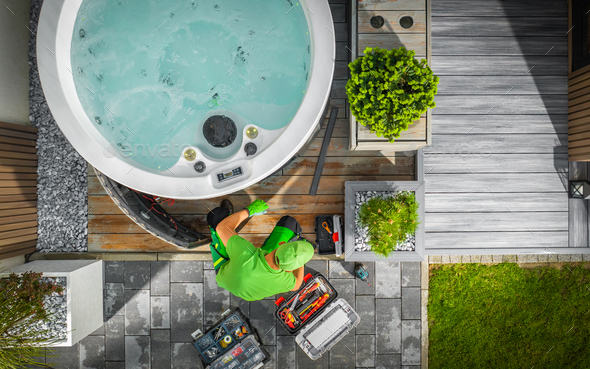 Aerial View of Hot Tub Technician Performing Garden SPA Repair - Stock Photo - Images