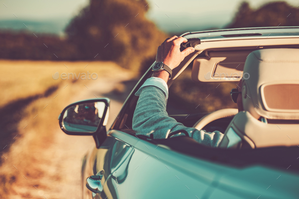 Driver Enjoying Summer Road Trip in His Cabriolet Convertible Car - Stock Photo - Images
