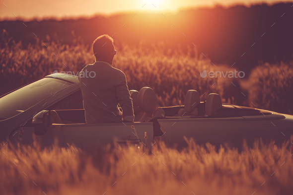 Man Looking For Calm Open Space To Relax Himself During His Convertible Car Drive - Stock Photo - Images