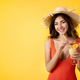 Cheerful millennial mixed race lady in swimsuit and hat with tropical cocktail enjoy vacation - PhotoDune Item for Sale