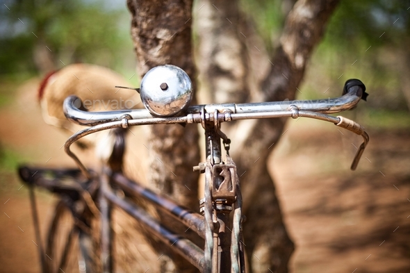 Closeup shot of an old bicycle bell with a blurred background