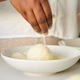 Close up of cuban woman hands breading mashed potatoes balls. - PhotoDune Item for Sale