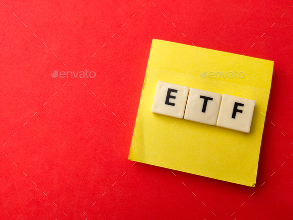 Toys word and sticky note with word ETF on red background. - Stock Photo - Images