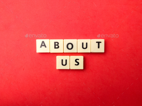 Toys word with word ABOUT US on a red background - Stock Photo - Images