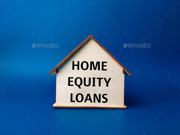 Wooden house with text HOME EQUITY LOANS - Stock Photo - Images