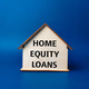Wooden house with text HOME EQUITY LOANS - PhotoDune Item for Sale