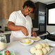 Young cuban woman breading mashed potatoes balls. - PhotoDune Item for Sale