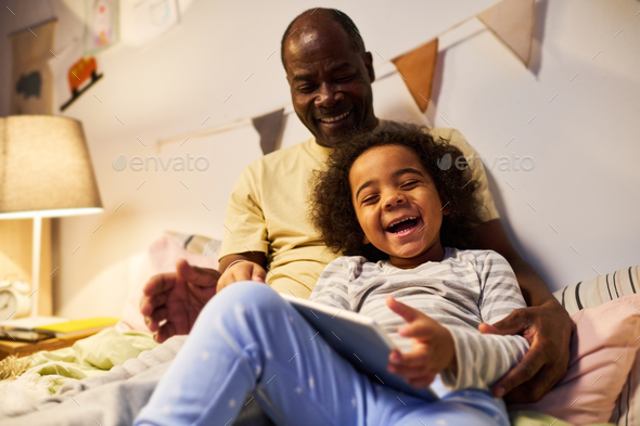 Happy dad using tablet pc with his son - Stock Photo - Images