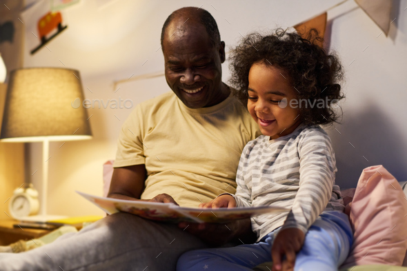 Dad reading tale to his little son - Stock Photo - Images