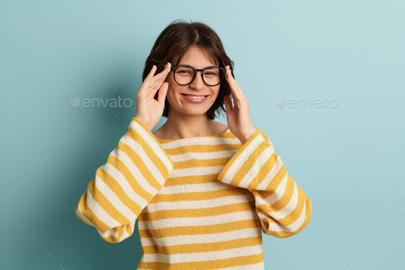 Happy lady in glasses in studio - Stock Photo - Images