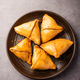 Indian sweet samosa is a Fried pastry soaked in sugar syrup filled with coconut, nuts and fruits - PhotoDune Item for Sale