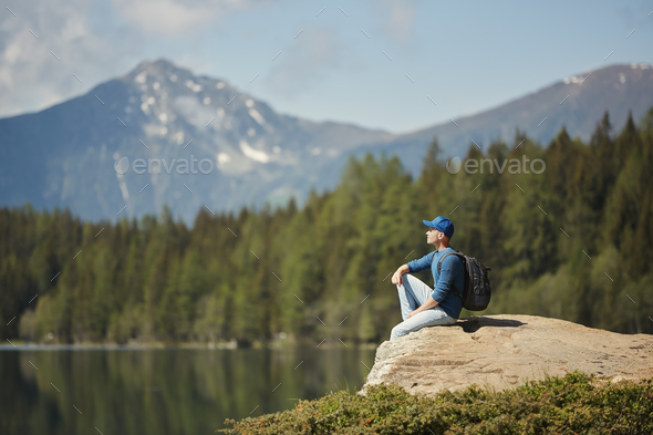 Man enjoying scenic mountain view - Stock Photo - Images