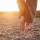 Close up of womans barefoot feet walking on rock beach. - PhotoDune Item for Sale