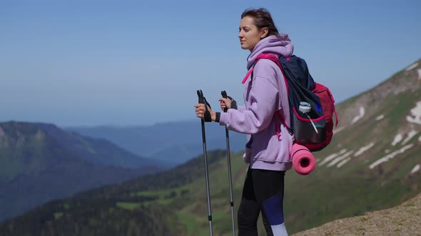 Inspired Young Woman at Top of Mount Travelling and Backpacking in Mountains alt
