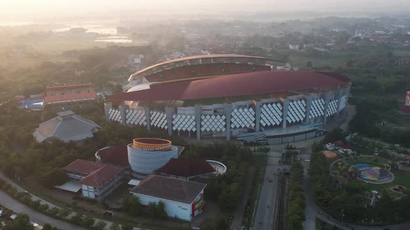 Aerial top down view of the Beautiful scenery of Wibawa Mukti Stadium when sunrise alt