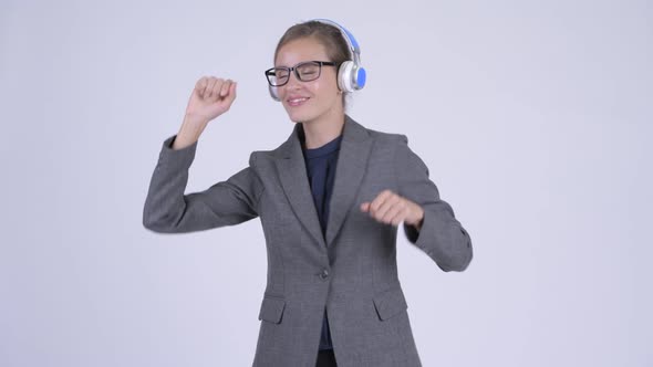 Young Businesswoman Listening To Music and Looking Guilty alt