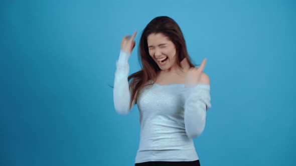 Female Winner She Makes the Gesture of Victory and Enjoys Victory By Moving Her Hands alt