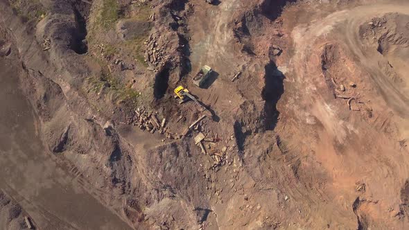 Aerial View of Working Excavator in the Opencast Mine alt