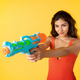cheerful millennial mixed race lady in swimsuit shoots water pistol has fun, enjoys vacation - PhotoDune Item for Sale