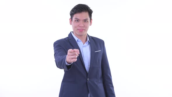 Happy Young Asian Businessman Pointing at Camera alt
