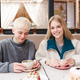 Smiling love couple of teen girl and boy spend time together in coffee house - PhotoDune Item for Sale