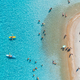 Aerial view of kayaks, swimming people in blue sea, sandy beach - PhotoDune Item for Sale