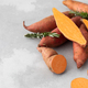 Raw sweet potatoes whole and cut. Orange kumara, sweet potato. Harvesting of root crops. Copy space - PhotoDune Item for Sale