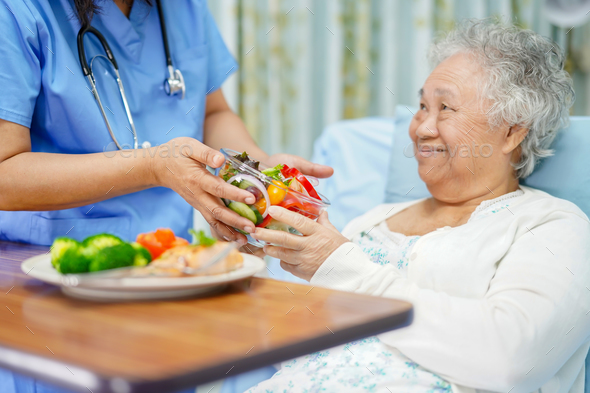 Asian elderly woman patient eating breakfast healthy food. - Stock Photo - Images