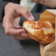  taking fresh baked croissant out from a paper packet  - PhotoDune Item for Sale