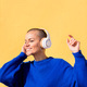 woman dancing listening to music in her headphones - PhotoDune Item for Sale