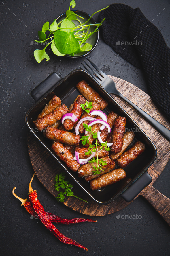 Traditional south european skinless sausages cevapcici made of ground meat and spices - Stock Photo - Images