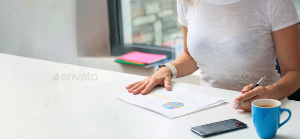 Woman working in an office background - Stock Photo - Images