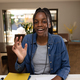 Happy african american teenager girl sitting at table and having video call - PhotoDune Item for Sale