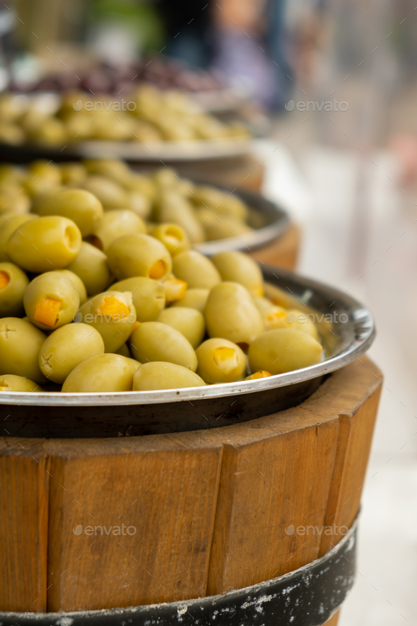 Different marinated olives and local food on street market in Gdansk, Poland. Selling and buying - Stock Photo - Images