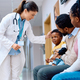 Female doctor and black family in hallway at pediatric clinic. - PhotoDune Item for Sale