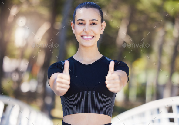 Happy Female Athlete Showing Thumbs Up With Both Hands While Out For A Run Or Jog Outdoors Fit
