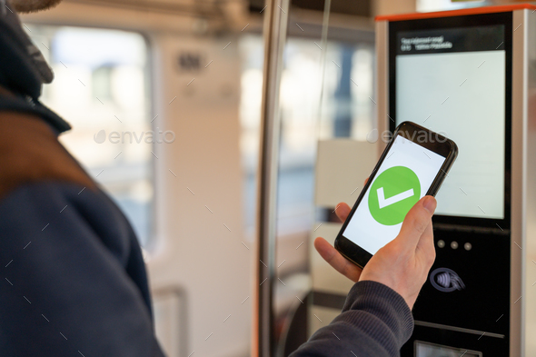 Person buying train ticket with smartphone - Stock Photo - Images
