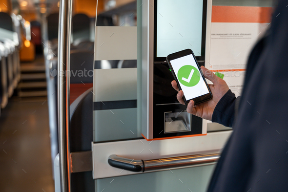 Person buying train ticket with smartphone - Stock Photo - Images
