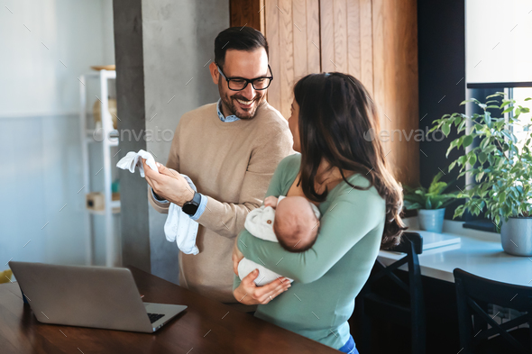 Online shopping. Young family with infant child purchasing things on internet together. - Stock Photo - Images