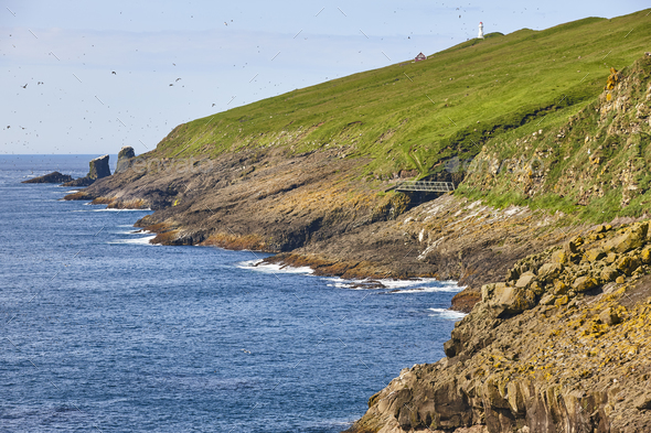 Mykines lighthouse and cliffs on Faroe islands. Hiking landmark - Stock Photo - Images