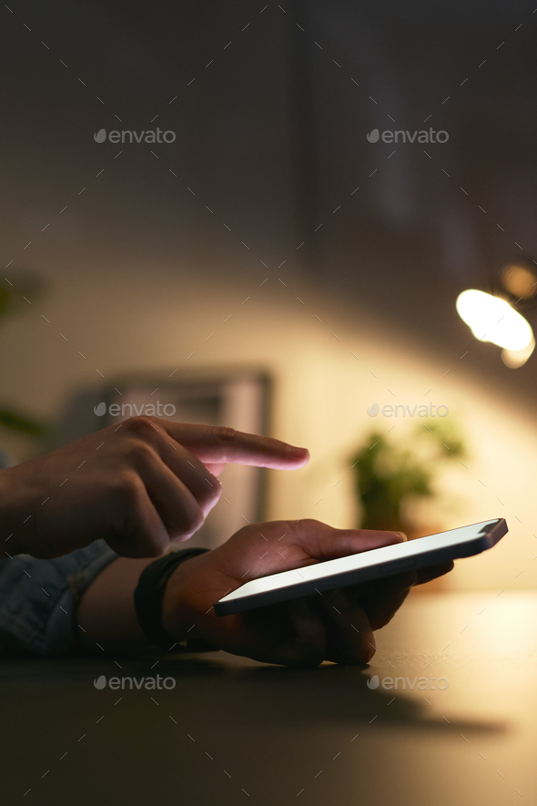 Close Up Of Woman Using Mobile Phone At Home At Night With Illuminated Screen - Stock Photo - Images