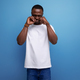 upset young african man in white t-shirt on studio background with copy space - PhotoDune Item for Sale