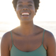 Close-up portrait of african american young woman with afro short hair laughing against clear sky - PhotoDune Item for Sale
