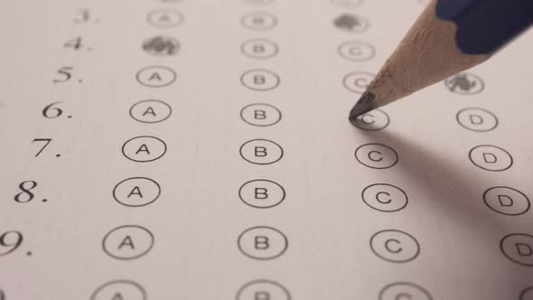 Shading With Pencil The Chosen Correct Answer In Multiple Choice Exam. Close Up alt
