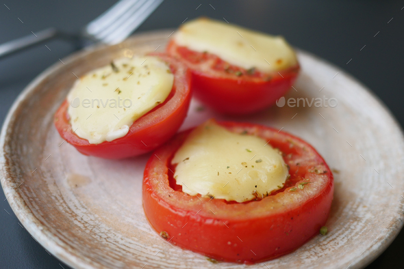 Tomatoes stuffed with cheese from the oven - Stock Photo - Images
