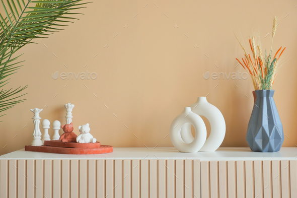 home interior decoration against light orange color wall . - Stock Photo - Images