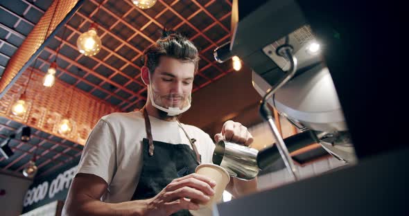Barista at Work Making a Cup of Strong Coffee in a Modern Coffee Machine alt