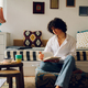 Portrait of a beautiful woman reading a book and drinking coffee at home - PhotoDune Item for Sale