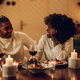 African american couple having romantic date and drinking wine at home - PhotoDune Item for Sale